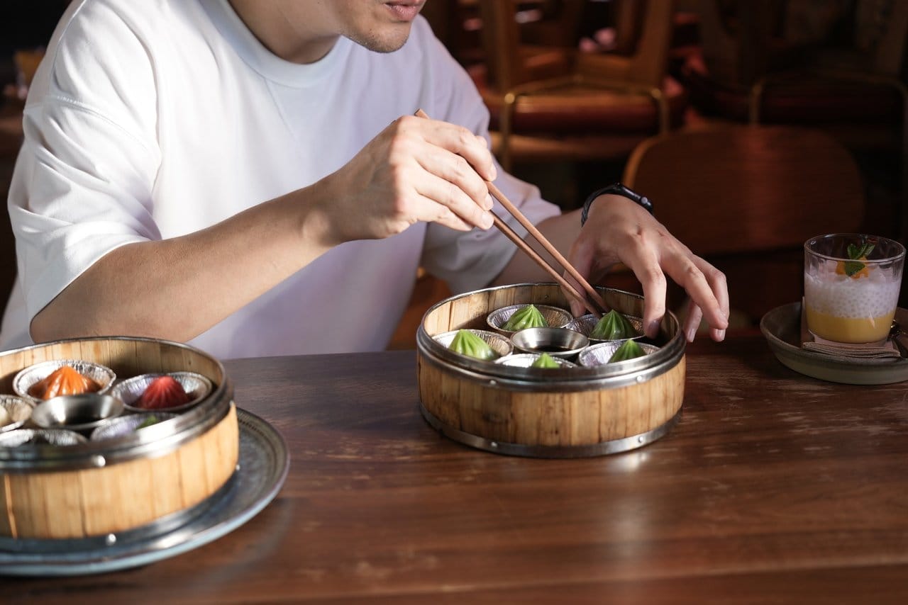 A Lucky 8 table filling up with small plates to share